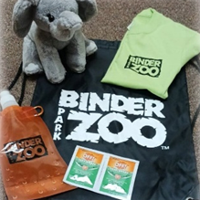 Stuffed elephant, t-shirt, water pouch, bug wipes, and drawstring bag